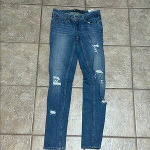 Levi’s Demi Curve blue distressed low rise skinny jeans